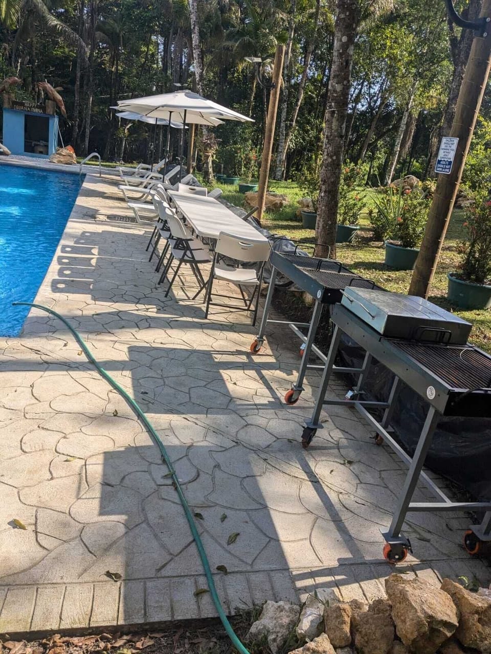 At the pool, there are tables and chairs, grills for you to use.