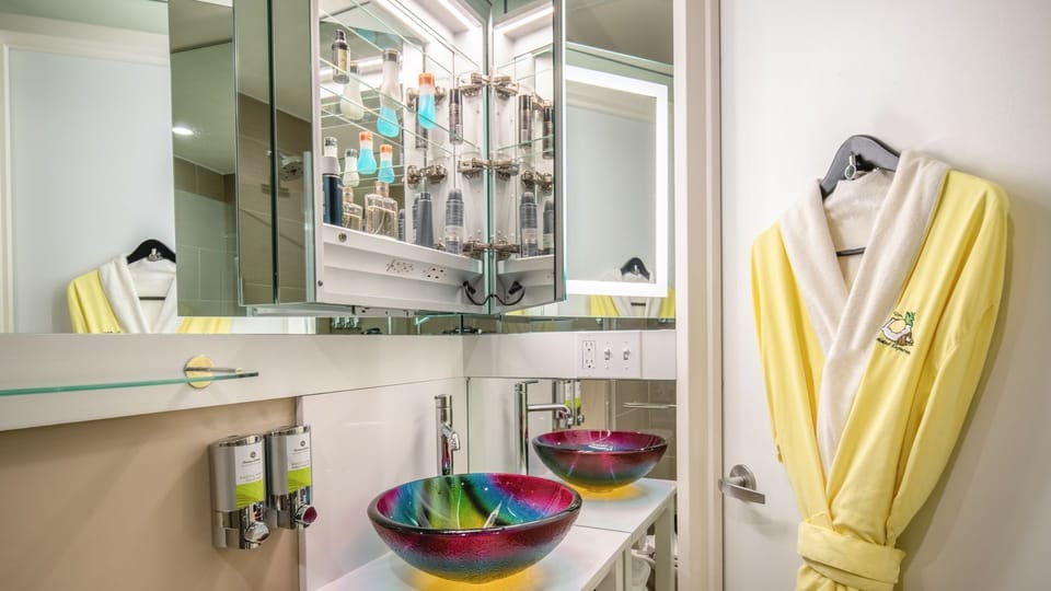 Indulge at the colorful vanity with plush robe ready.