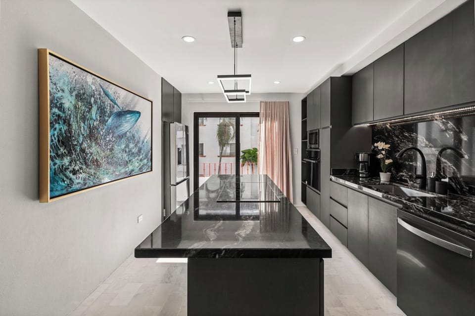 Custom Dream Kitchen with island cooktop and plenty of storage