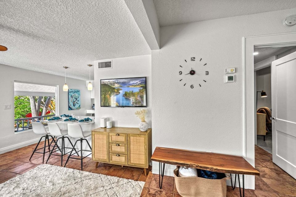 Bright interior with connected living and kitchen areas.