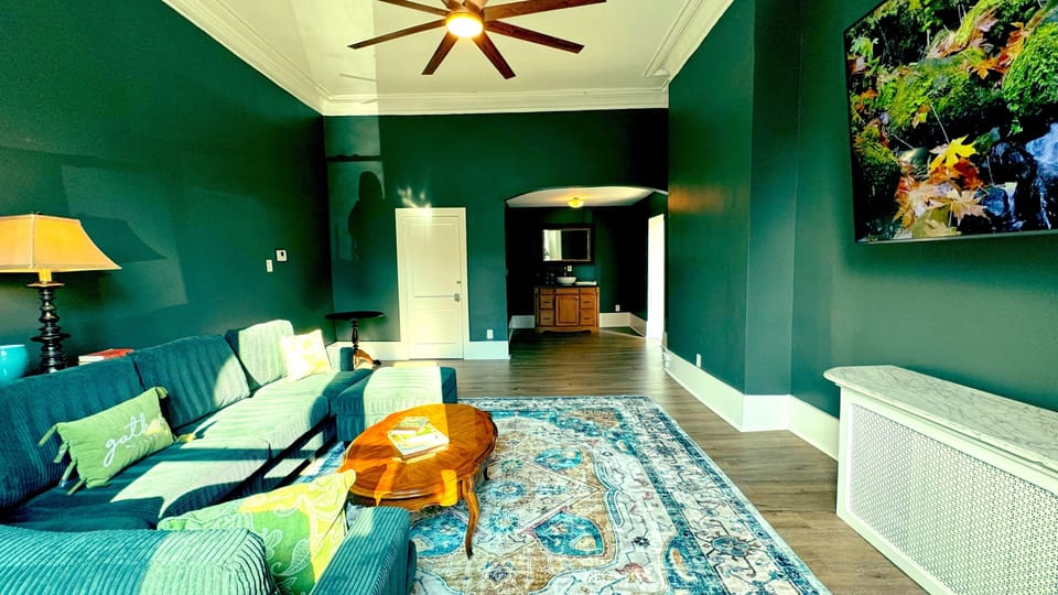 Enjoy the spacious living room with soaring ceilings that create an open, airy feel. 