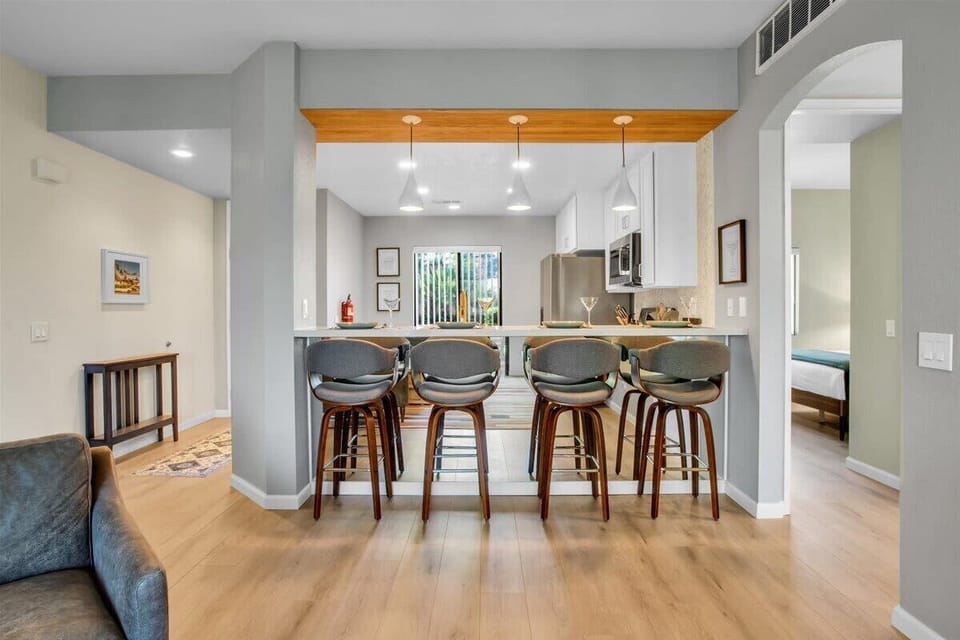 Gather around the stylish kitchen bar with seating for four. Step into a chef’s paradise in this modern kitchen, where functionality meets style. It invites you to cook and gather with friends and family.
