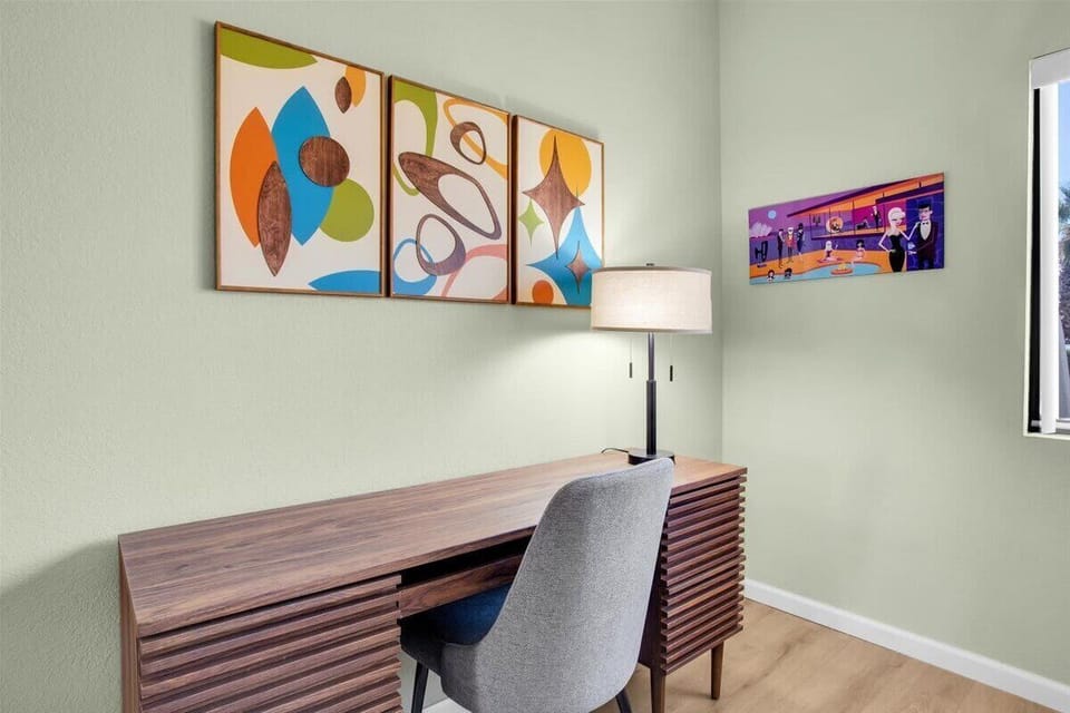 Bright and airy guest bedroom featuring a comfortable Queen bed, a dedicated desk for work or leisure, and ample storage for your belongings. Perfect for a relaxing stay or productive getaway!