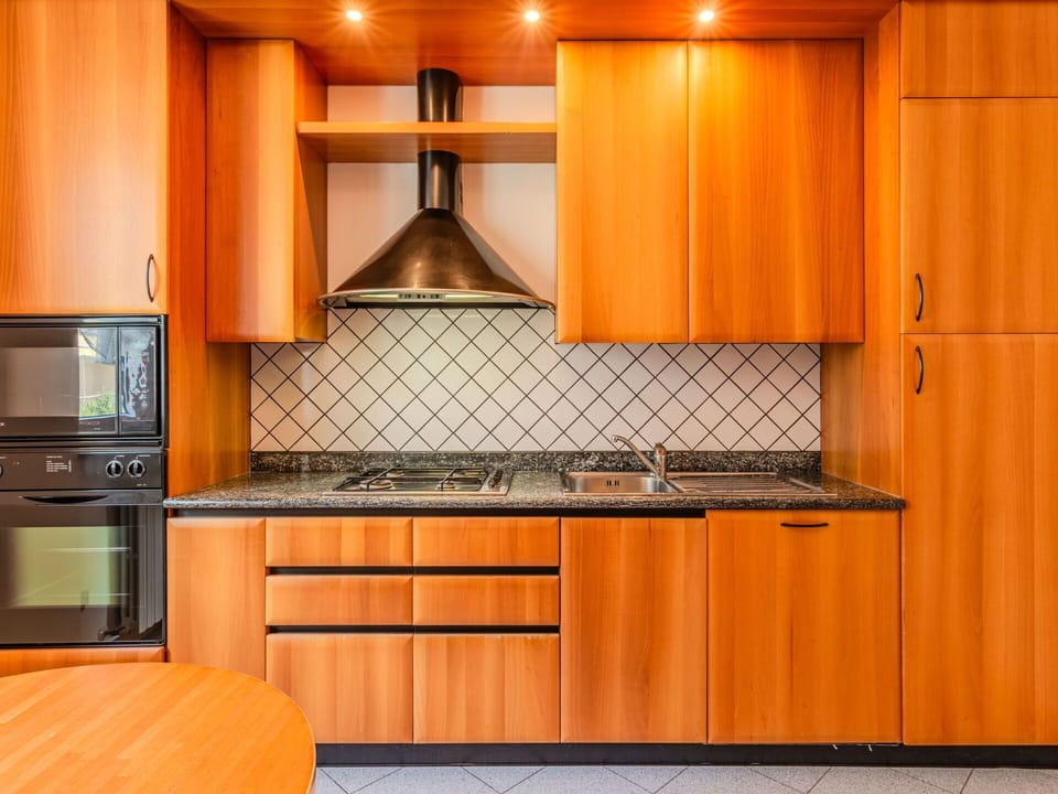 Kitchen, Major Appliance, Wood, Countertop, Kitchen Appliance, Interior Design, Cabinetry, Flooring, Floor, Orange