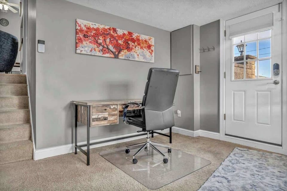 A dedicated office space with comfy seating.