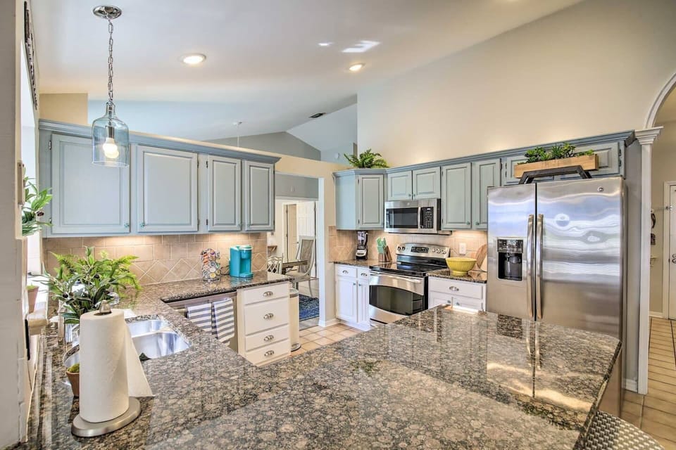 Beautiful kitchen packed with amenities.