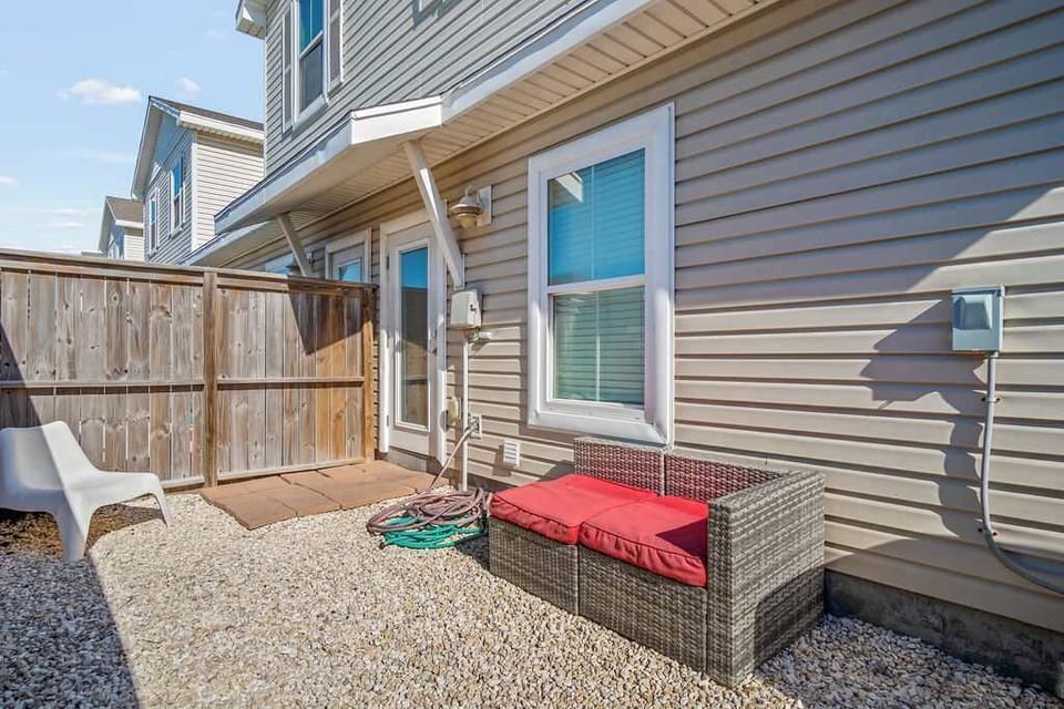 Unwind and enjoy the fresh air with our inviting outdoor seating in the backyard