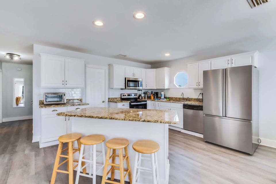  It has a large island that is great for food prep or gathering around. Upper Level