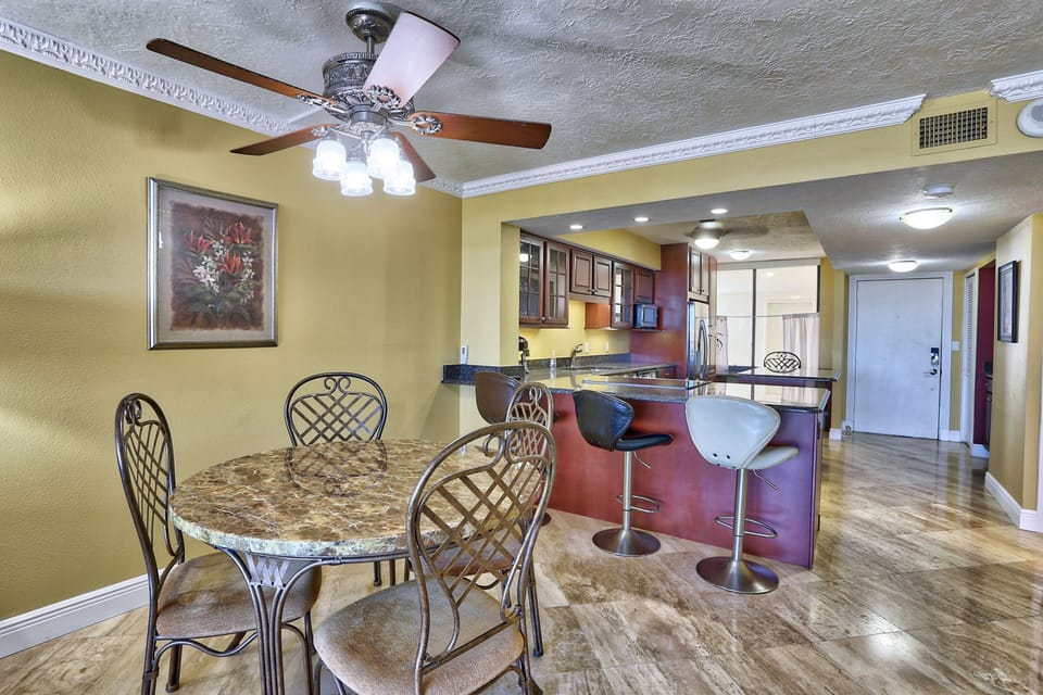 Dining table for 4 with more seating at the bar