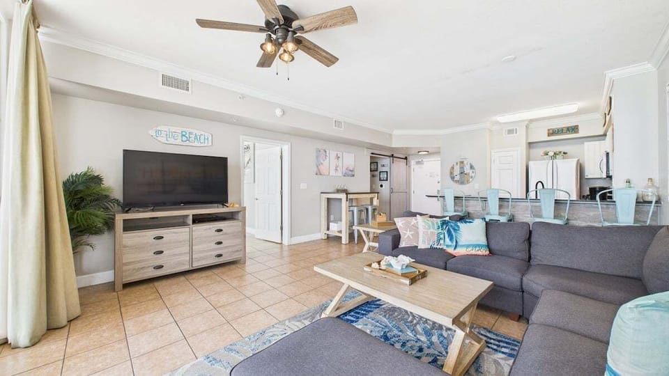 Open concept living area with comfortable furnishings TV