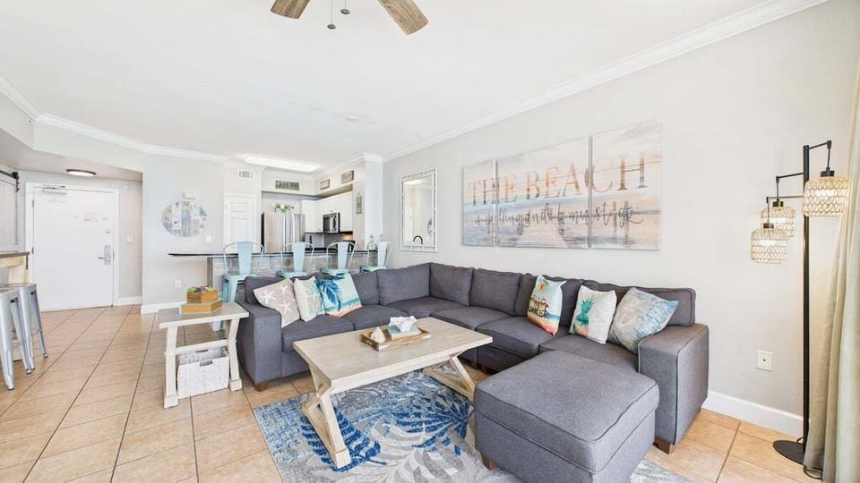Open concept living area with comfortable furnishings TV