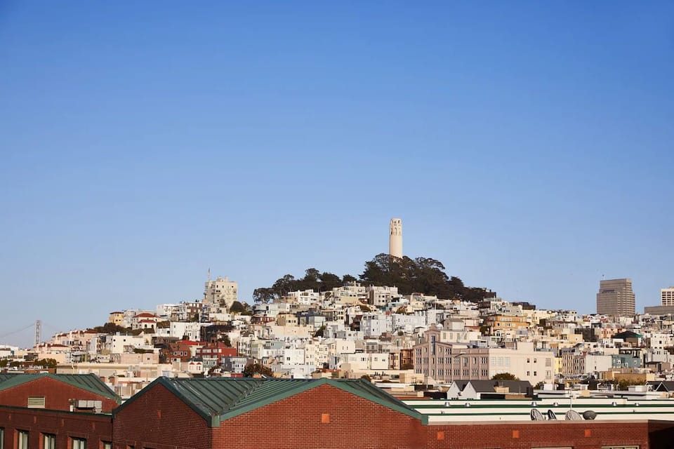 Explore charming hillside streets with skyline views nearby.