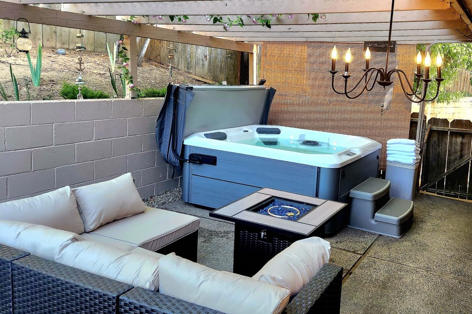 Enjoy the Hot tub with therapeutic jets, comfy seating, and gas fireplace.
