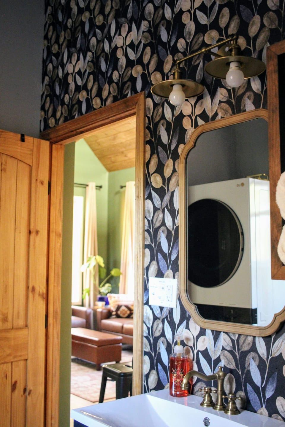 Full Bathroom with deep tub and shower and washer/dryer combo