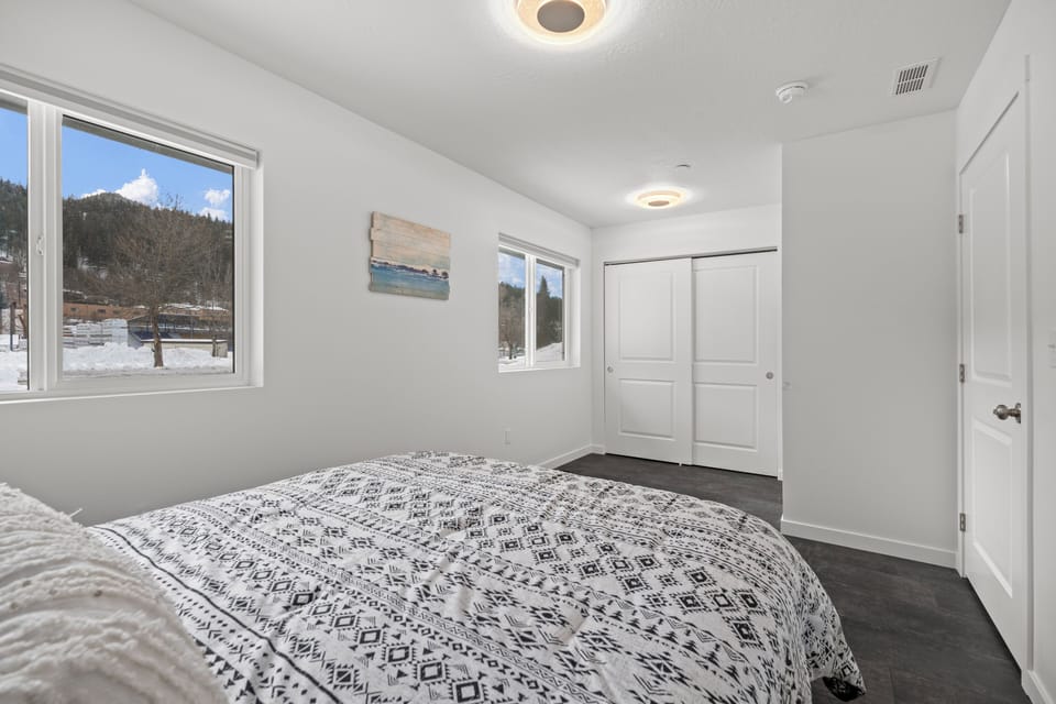 Second well appointed bedroom with queen bed and large closet.