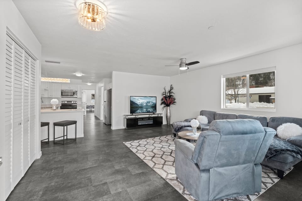 Large open livingroom and kitchen with fireplace