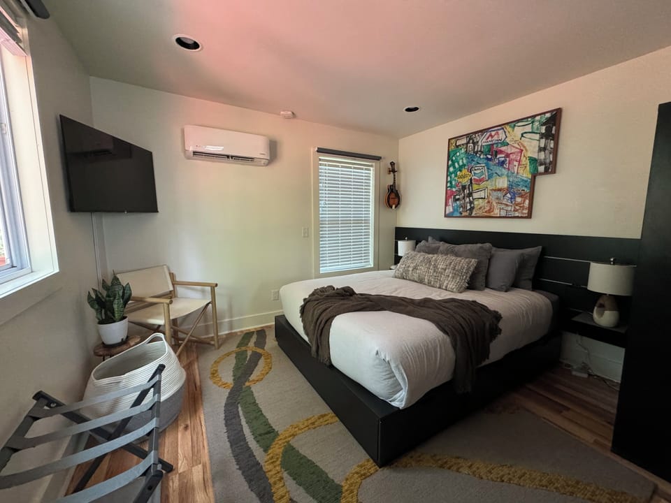 Comfortable queen sized bed. Storage for clothing in dresser shelves under bed.