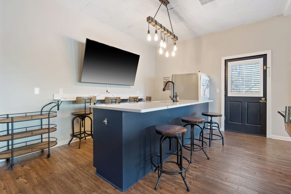 Downstairs bar with two TV’s never miss a game or your favorite movie.
