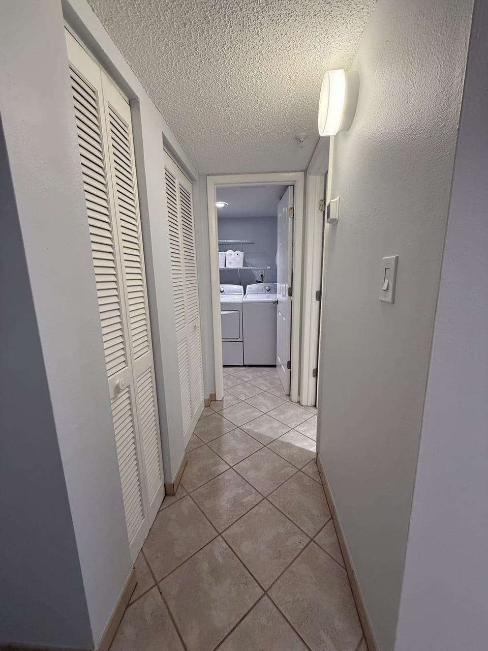 Hallway to laundry room and powder room.