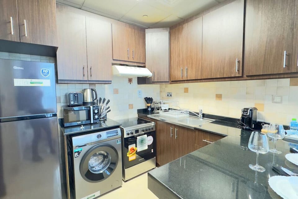A fully equipped kitchenette, perfect for quick meals or morning coffee.