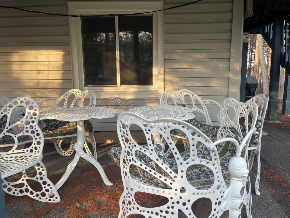 Butterfly chairs and tables under the deck