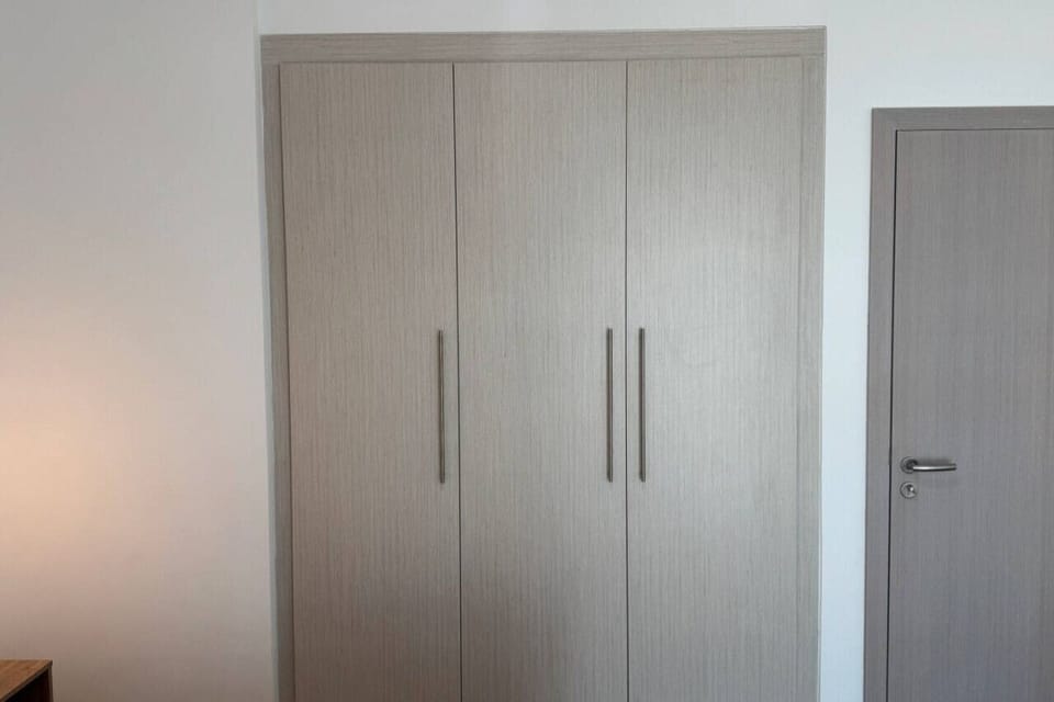 A stylish wardrobe to keep your outfits organized and your stay stress-free.