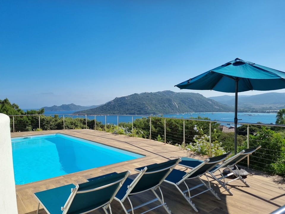 Water, Sky, Azure, Shade, Swimming Pool, Plant, Building, Outdoor Furniture, Architecture, Umbrella