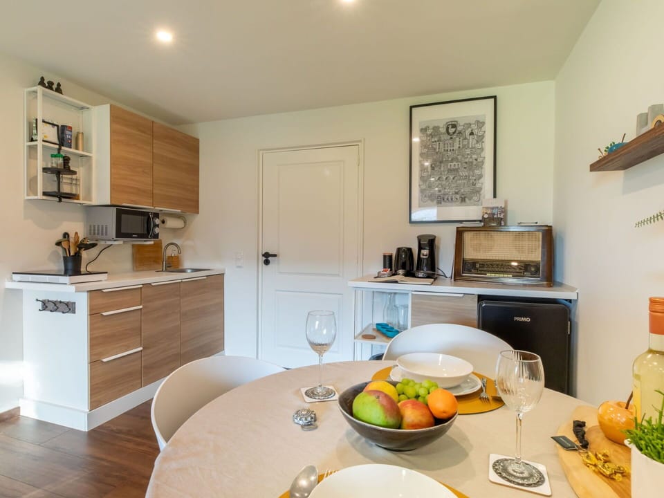 Furniture, Countertop, Kitchen, Interior Design, Kitchen Appliance, Major Appliance, Flooring, Cabinetry, Wood, Floor
