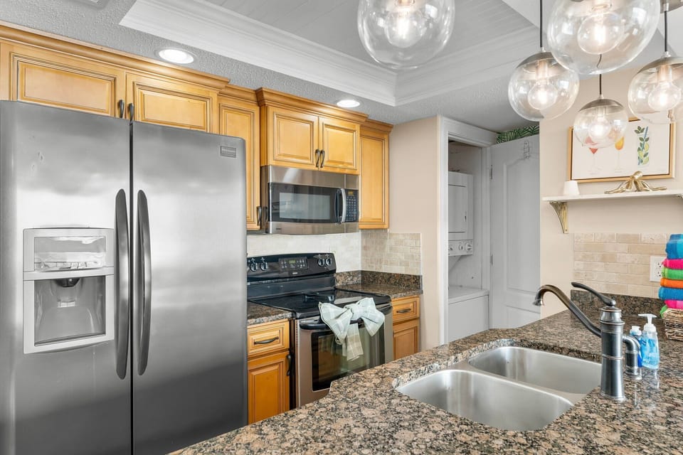 Kitchen area with plenty of kitchenware & appliances