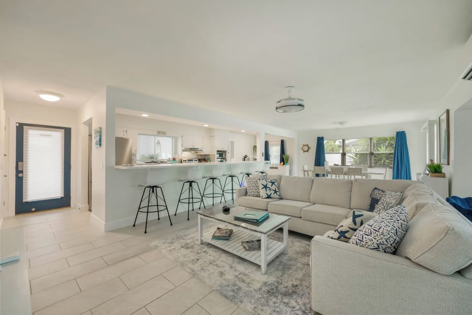 Six bar stools offer additional seating at the kitchen counter