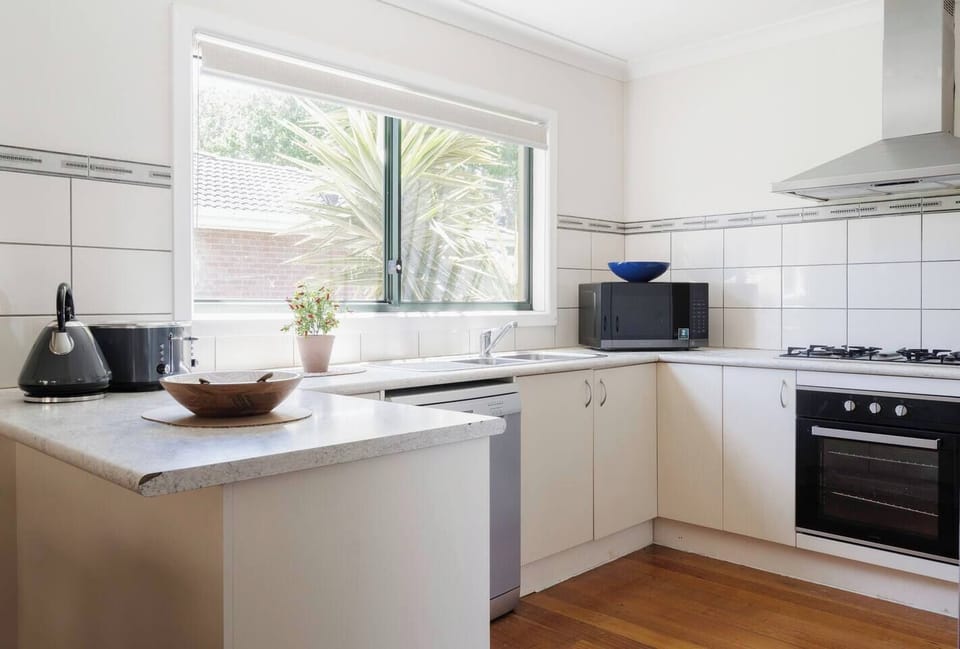 Whip up a storm in the well-equipped kitchen offering ample counter space, an oven, dishwasher, and a Nespresso machine.
