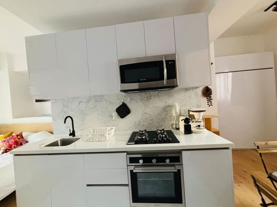 Enjoy a sleek, fully-equipped kitchen where you can craft gourmet meals with ease or simply sip your morning coffee.