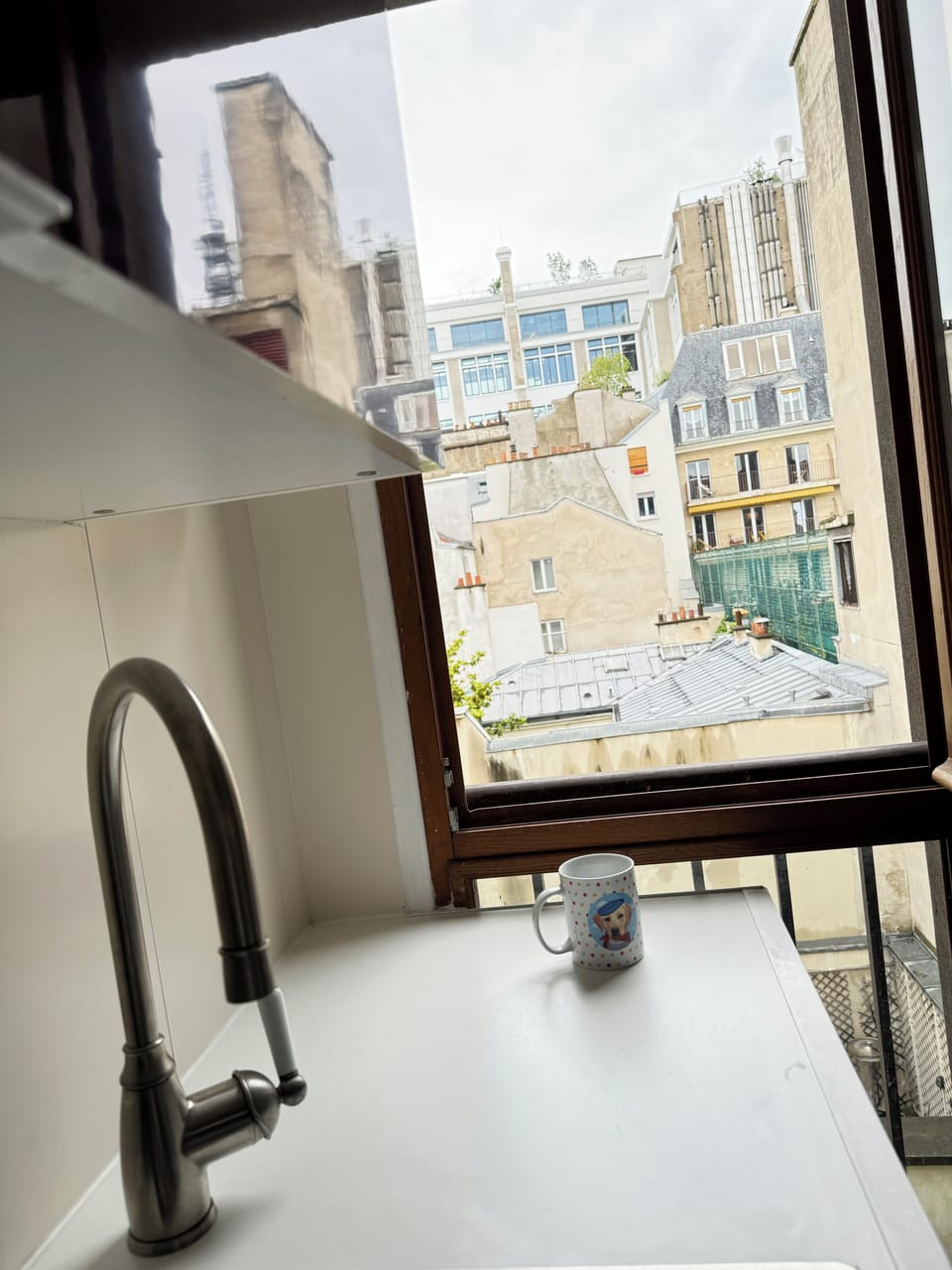 Morning coffee in the kitchen overlooking Paris rooftops