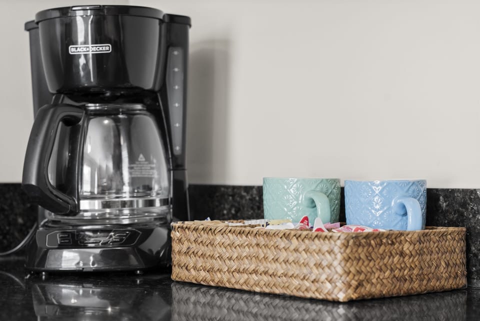 Wake up to fresh coffee with a convenient in-unit coffee station stocked with mugs and supplies.
