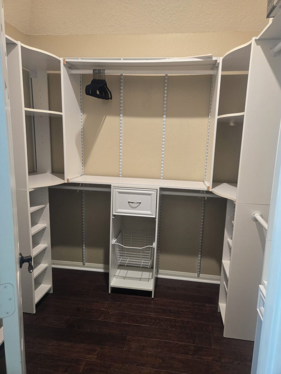 Master closet with hangers on site.