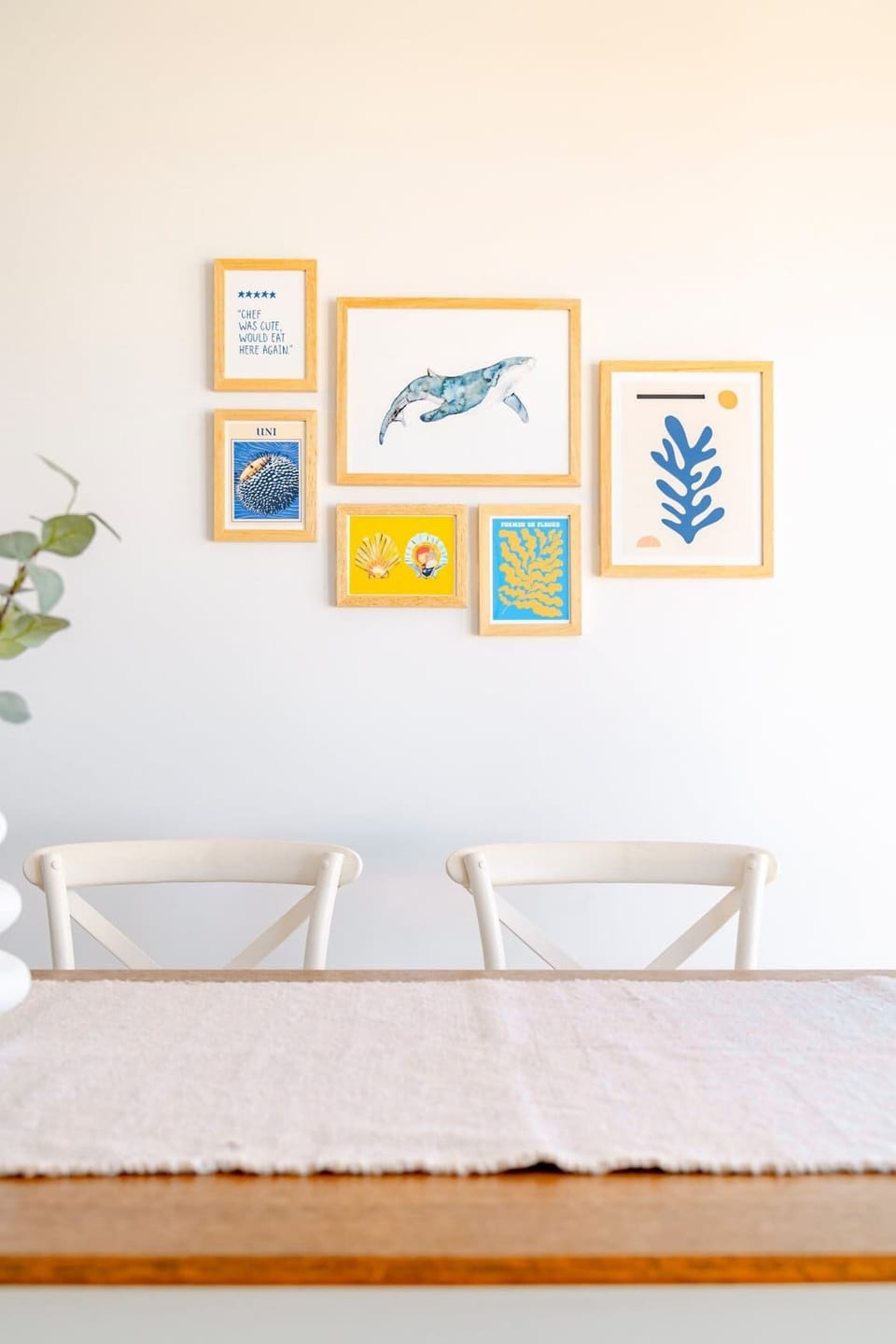Beautifully curated coastal artworks create a calming and welcoming atmosphere