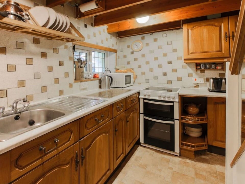 Cabinetry, Countertop, Property, Sink, Furniture, Kitchen Sink, Tap, Building, Kitchen, Wood