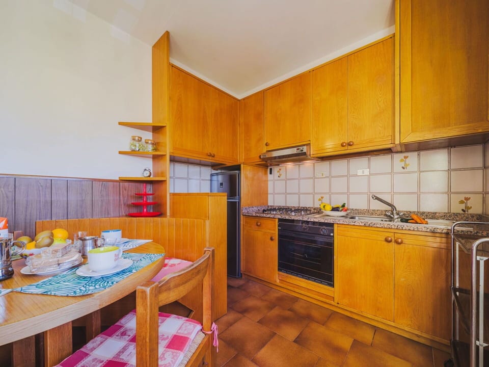 Cabinetry, Property, Furniture, Countertop, Kitchen Sink, Wood, Kitchen, Kitchen Stove, Orange, Sink