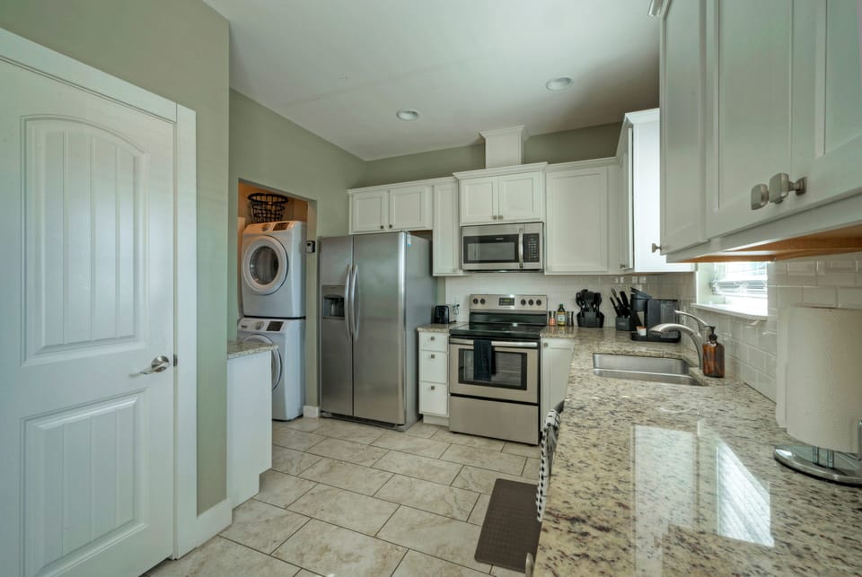 Fully equipped kitchen and in-home laundry.