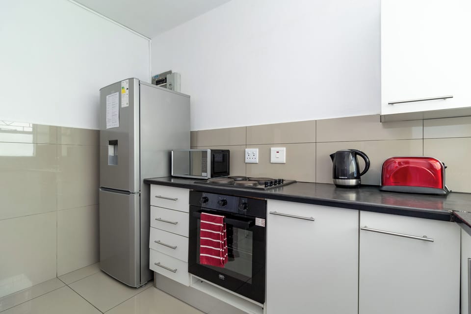 Kitchen with everything you need to cook a meal. 