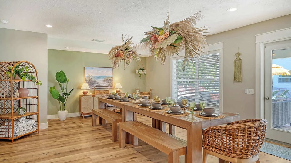 The dining room overlooks the pool area, offering a picturesque setting for family-style meals and creating a warm, inviting space for memorable gatherings.