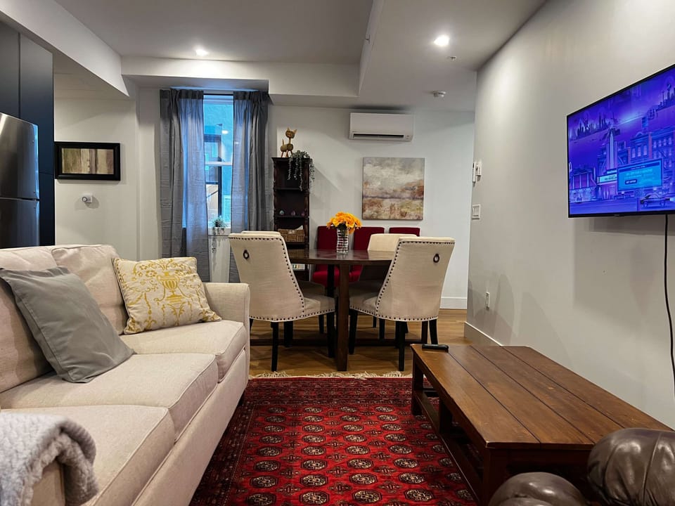 Plenty of room for everyone with cozy seating, a recliner, and a full dining setup.