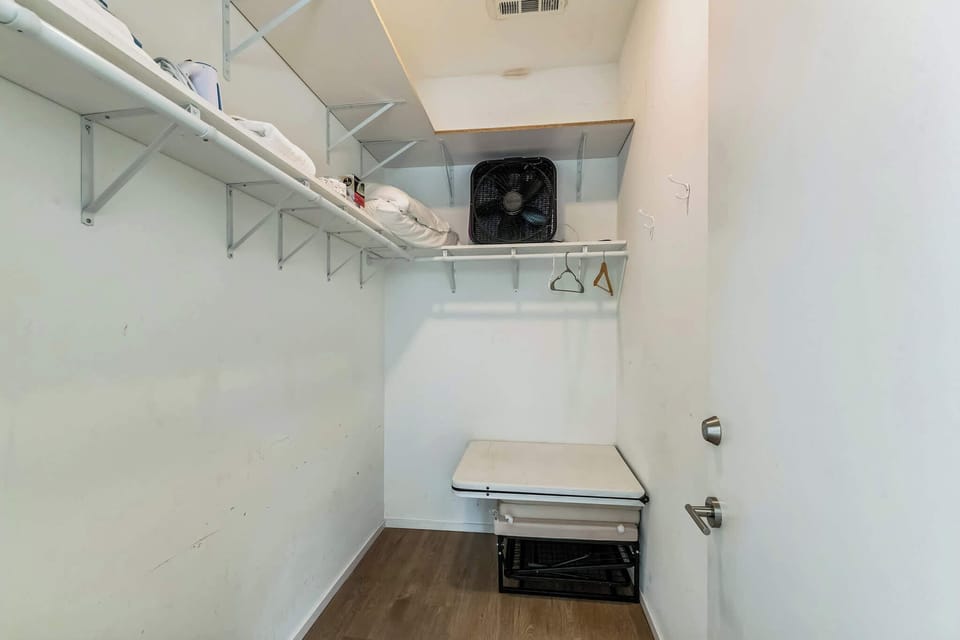 Keep clothes and bags neatly tucked away in the second bedroom closet