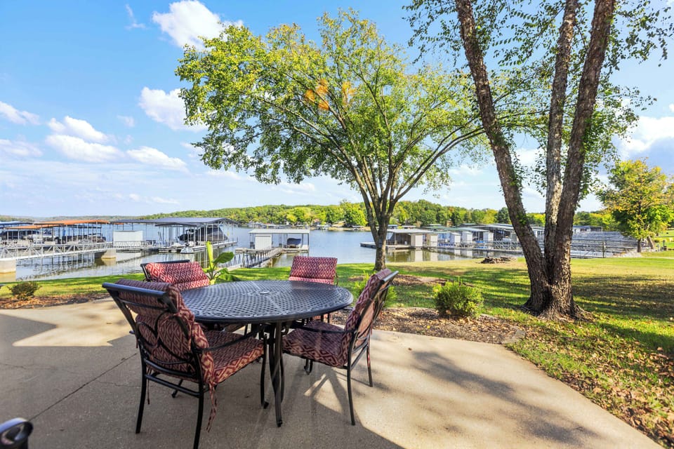 Patio with outdoor seating grill, and lake view