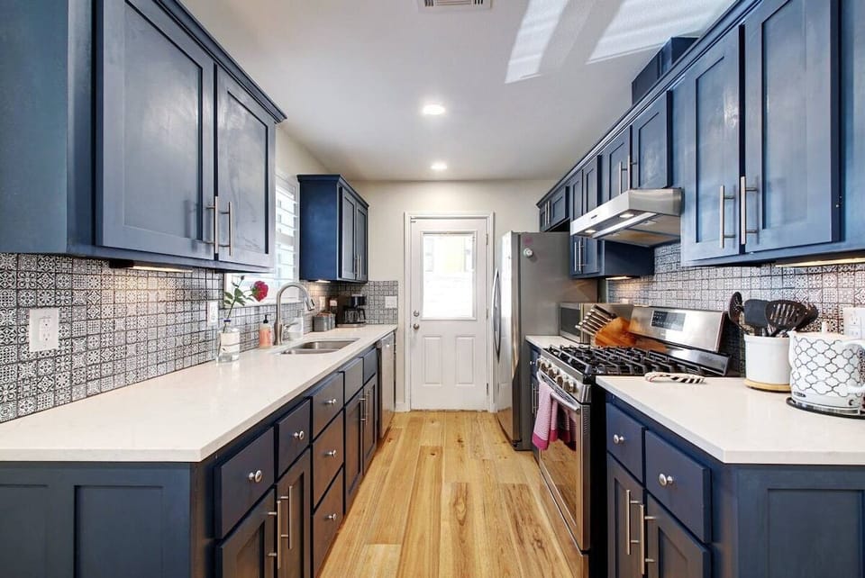 The kitchen is fully stocked with everything you need to prepare a meal including spices, pots, pans, and more! 