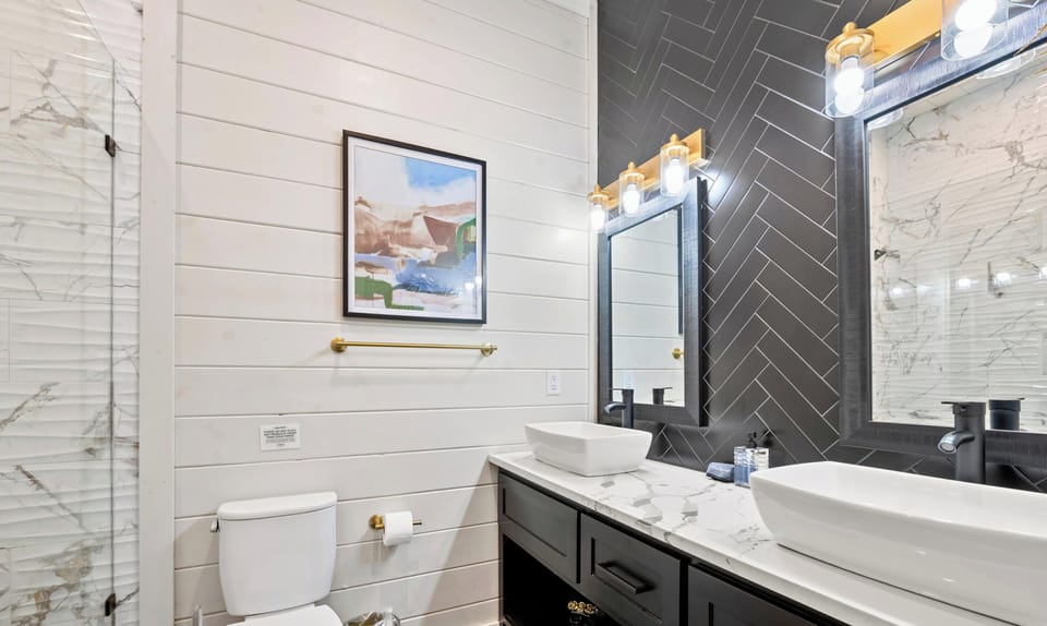 Double vanities and plenty of counter space make getting everyone ready in the morning simple and stress free.