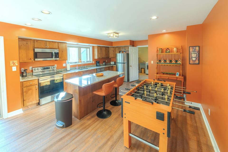 Kitchen has new granite countertops, cabinets, and stainless steel appliances.