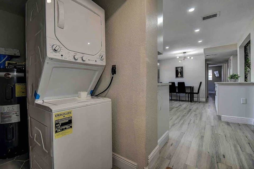Convenient laundry area equipped with a washer and dryer for your comfort. #LaundryArea #Convenience #HomeComfort