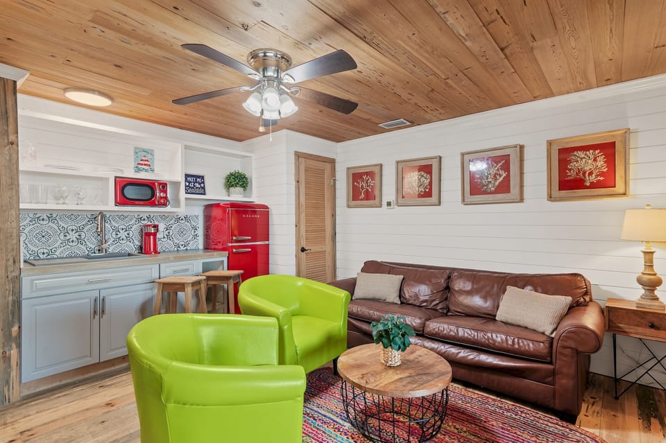 The 1st Floor features another Living Room w/ 50" Smart TV, Multi-Game Arcade Table, a Kitchenette, and Patio Access - Great for the Kids!