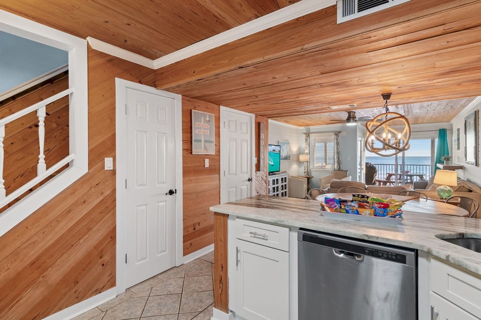 2nd Floor has the Primary Living Space with a comfortable, Gulf View living room w/ 55" Smart TV, Remodeled Kitchen, Dining Space, and Half Bath.